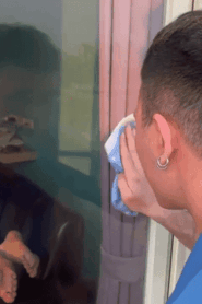 Two Young Muscular Men Share a Private Moment in the Bedroom