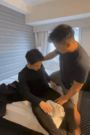 Two Young Muscular Men Share a Private Moment in the Bedroom