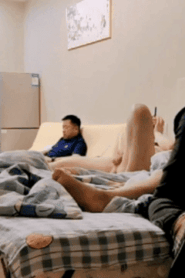 Three Young Muscular Men in an Intimate Bedroom Scene