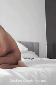 Two Young Lean Muscular Men in an Intimate Bedroom Scene