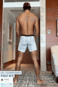 A Young Muscular Man in an Intimate Hotel Room Scene