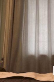 Two Young Muscular Men in an Intimate Bedroom Scene