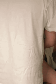 Two Young Muscular Men in an Intimate Bedroom Scene
