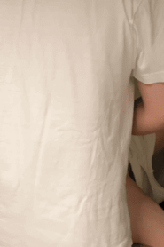 Two Young Muscular Men Share a Private Moment in the Bedroom