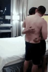 Two Young Muscular Men in an Intimate Hotel Room Scene