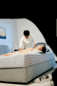 Two Prime-Age Athletic Men in an Intimate Bedroom Scene