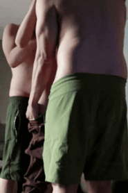 Two Prime-Age Muscular Men Share a Private Moment in the Sofa Setting