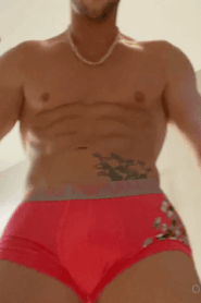 A Young Muscular Man in an Intimate Bathroom Scene