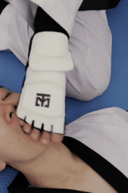 Two Young Sporty Men Share a Private Moment in the Indoor Setting