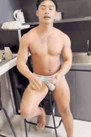 Two Young Muscular Men Share a Private Moment in the Bedroom