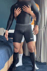 Two Young Muscular Men Share a Private Moment in the Bedroom