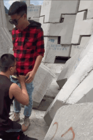 Two Young Muscular Men in an Intimate Outdoor Scene