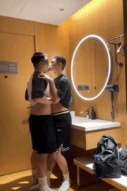 Two Young Bulky Men Share a Private Moment in the Bedroom