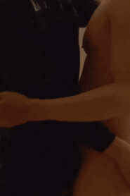Two Young Muscular Men in an Intimate Bedroom Scene