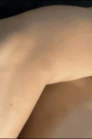 Two Young Muscular Men Share a Private Moment in the Bedroom
