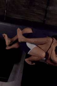 Two Young Muscular Men in an Intimate Indoor Scene