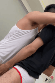 Three Young Muscular Men in an Intimate Bedroom Scene