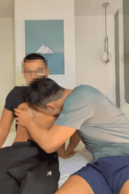 Two Young Muscular Men Share a Private Moment in the Bedroom
